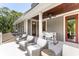 Relaxing balcony with comfortable seating, perfect for enjoying outdoor living and treetop views at 34 Eugenia Ave # B, Kiawah Island, SC 29455