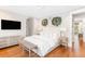 Spacious bedroom showcases a plush bed, stylish decor, and hardwood flooring at 34 Eugenia Ave # B, Kiawah Island, SC 29455