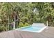 Deckside pool surrounded by lush greenery, offering a private and tranquil retreat at 34 Eugenia Ave # B, Kiawah Island, SC 29455
