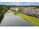 Aerial view of the complex featuring a pond, mature landscaping, and private screened-in porches at 3588 Bagley Dr, Mount Pleasant, SC 29466