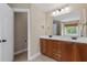 Bathroom with double sink vanity with wood cabinets, tiled floors, and access to the toilet room at 3588 Bagley Dr, Mount Pleasant, SC 29466