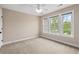 Bedroom features three windows for natural light and a ceiling fan at 3588 Bagley Dr, Mount Pleasant, SC 29466