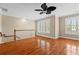 A bright bonus room featuring hardwood floors, neutral walls, natural light, and a ceiling fan at 3588 Bagley Dr, Mount Pleasant, SC 29466