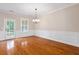 Bright dining area with hardwood floors, wainscoting, and an outdoor view at 3588 Bagley Dr, Mount Pleasant, SC 29466