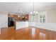 Dining area with hardwood floors, chandelier, wainscoting, and easy access to the outdoor patio at 3588 Bagley Dr, Mount Pleasant, SC 29466