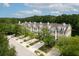 Beautiful exterior view of townhomes with manicured landscaping, sidewalks, and lush trees lining the street at 3588 Bagley Dr, Mount Pleasant, SC 29466