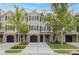 Charming townhome with brick and tan siding, black shutters, well-maintained landscaping, and a two-car garage at 3588 Bagley Dr, Mount Pleasant, SC 29466