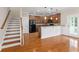 A kitchen with hardwood flooring, wood cabinets, a breakfast bar, and stainless steel appliances at 3588 Bagley Dr, Mount Pleasant, SC 29466