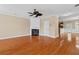Open-concept living area with hardwood floors, fireplace, and a view into the kitchen; neutral color scheme at 3588 Bagley Dr, Mount Pleasant, SC 29466