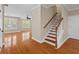 Bright living room with hardwood floors, staircase and natural light from the shuttered windows at 3588 Bagley Dr, Mount Pleasant, SC 29466