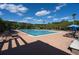 Community pool with deck furniture surrounded by mature trees at 3588 Bagley Dr, Mount Pleasant, SC 29466