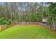 Large fenced backyard featuring a lush green lawn and mature trees at 3636 Purple Martin Ct, Mount Pleasant, SC 29466