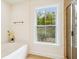 Bright bathroom featuring a soaking tub and separate tiled shower at 3636 Purple Martin Ct, Mount Pleasant, SC 29466
