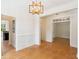 Bright dining room featuring natural light and detailed trim, leading to a kitchen and study at 3636 Purple Martin Ct, Mount Pleasant, SC 29466