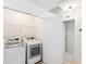 Well-organized laundry room with modern washer and dryer at 3636 Purple Martin Ct, Mount Pleasant, SC 29466