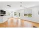 Open concept living room that features large windows and adjoins the kitchen at 3636 Purple Martin Ct, Mount Pleasant, SC 29466