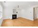 Bright living room featuring a black fireplace, ceiling fan, and large windows at 3636 Purple Martin Ct, Mount Pleasant, SC 29466