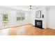 Bright living room with fireplace, ceiling fan, and a glass door leading to the outside at 3636 Purple Martin Ct, Mount Pleasant, SC 29466