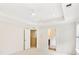 Bright main bedroom with tray ceiling, ceiling fan, ensuite bathroom and walk-in closet at 3636 Purple Martin Ct, Mount Pleasant, SC 29466