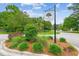 Somerset Oaks community sign on a landscaped traffic circle with mature trees and blue sky at 3636 Purple Martin Ct, Mount Pleasant, SC 29466