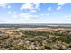 Wide aerial shot featuring residential properties amid lush trees and waterfront scenery at 38 Colleton Dr, Charleston, SC 29407