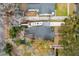 Aerial view of a property with a pool, RV parking and mature trees at 38 Colleton Dr, Charleston, SC 29407