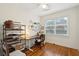 Bright bedroom featuring hardwood floors, a ceiling fan, and a window at 38 Colleton Dr, Charleston, SC 29407