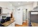 Functional kitchen with white cabinets, stainless appliances, and easy access to other rooms in the house at 38 Colleton Dr, Charleston, SC 29407