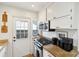 Well-equipped kitchen with stainless steel appliances and white cabinets, offering a functional cooking space at 38 Colleton Dr, Charleston, SC 29407