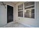 Exterior of the home featuring a black back door and an adjacent window at 4054 Cedars Pkwy # C, North Charleston, SC 29420