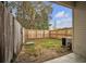 The backyard features a wood fence, lawn, and an outdoor air conditioning unit at 4054 Cedars Pkwy # C, North Charleston, SC 29420