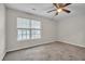 Spacious bedroom features carpet flooring, large window and a ceiling fan at 4054 Cedars Pkwy # C, North Charleston, SC 29420