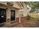 Charming townhome entrance features a black front door, brick accents, and inviting decor at 4054 Cedars Pkwy # C, North Charleston, SC 29420