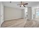 Bright open-concept living room with wood-look flooring and ceiling fan, perfect for entertaining at 4054 Cedars Pkwy # C, North Charleston, SC 29420