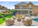 Expansive backyard with a pool, patio seating, and well-maintained landscaping, ideal for outdoor living at 4246 Club Course Dr, North Charleston, SC 29420