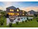 Beautiful backyard with brick home, outdoor seating, pool, landscaping, providing a great space for outdoor living at 4246 Club Course Dr, North Charleston, SC 29420