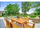 Outdoor dining and lounge area with a picturesque view of the pool and beautifully landscaped backyard at 4246 Club Course Dr, North Charleston, SC 29420