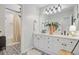 Modern bathroom with double vanity, decorative tile, matte black fixtures, and a view of a curtained shower at 4246 Club Course Dr, North Charleston, SC 29420