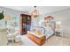 Cozy bedroom with nautical decor, a wooden chest, and a light blue buffalo check bedspread at 4246 Club Course Dr, North Charleston, SC 29420