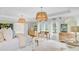 Spacious primary bedroom with decorative light fixtures, neutral colors and many windows at 4246 Club Course Dr, North Charleston, SC 29420