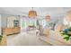 Spacious primary bedroom with decorative light fixtures, neutral colors and many windows at 4246 Club Course Dr, North Charleston, SC 29420