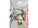 Walk-in closet with ample storage, shelving, hanging rods, and a decorative center table for accessories at 4246 Club Course Dr, North Charleston, SC 29420