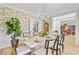 Bright dining room showcases decorative wallpaper, light-wood floors, and a beautifully set table at 4246 Club Course Dr, North Charleston, SC 29420