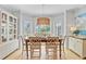 Dining room featuring a wooden table with six chairs and a built-in glass door display cabinet at 4246 Club Course Dr, North Charleston, SC 29420
