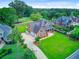 Lovely two-story brick home with manicured lawn and a wide driveway at 4246 Club Course Dr, North Charleston, SC 29420
