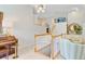 A welcoming loft area with a decorative chandelier and access to extra spaces at 4246 Club Course Dr, North Charleston, SC 29420