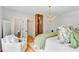 Bedroom featuring a cozy chair, hardwood floors, view of closet and bathroom at 4246 Club Course Dr, North Charleston, SC 29420
