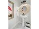 Stylish powder room with a pedestal sink, modern fixtures, and unique decor at 4246 Club Course Dr, North Charleston, SC 29420