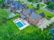 Aerial view showcasing a backyard with pool, lounge area, and landscaped yard at 4246 Club Course Dr, North Charleston, SC 29420