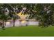 Spacious backyard view of a well-maintained white brick home, showcasing its serene outdoor setting at 4939 Ashby Ave, North Charleston, SC 29405